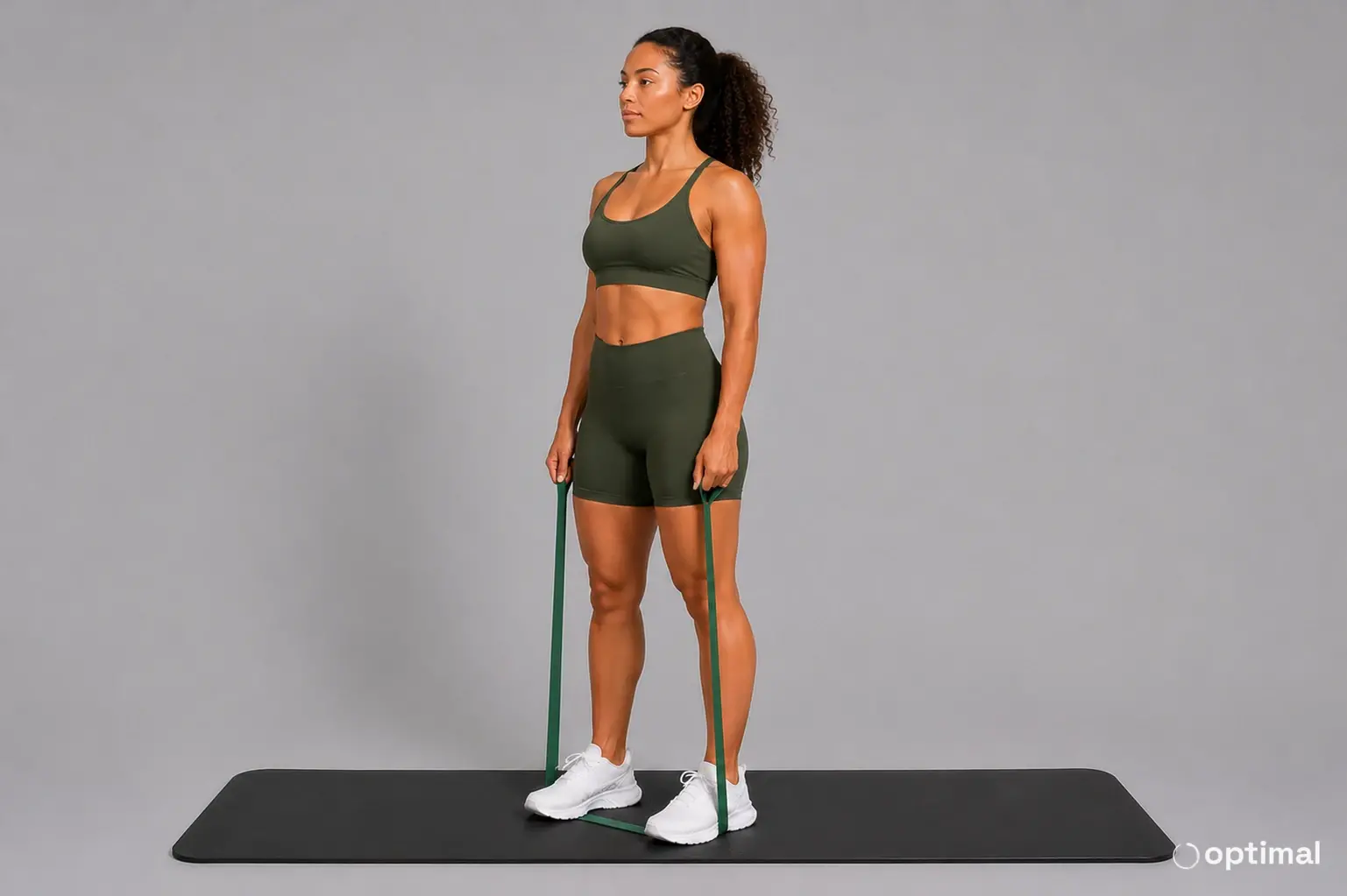 Band lateral raise start position with arms at the sides