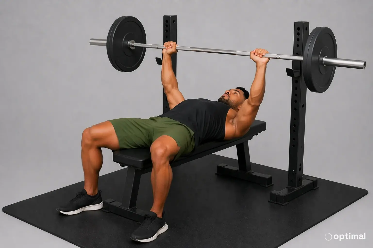 Man bench pressing with a controlled and sustainable load